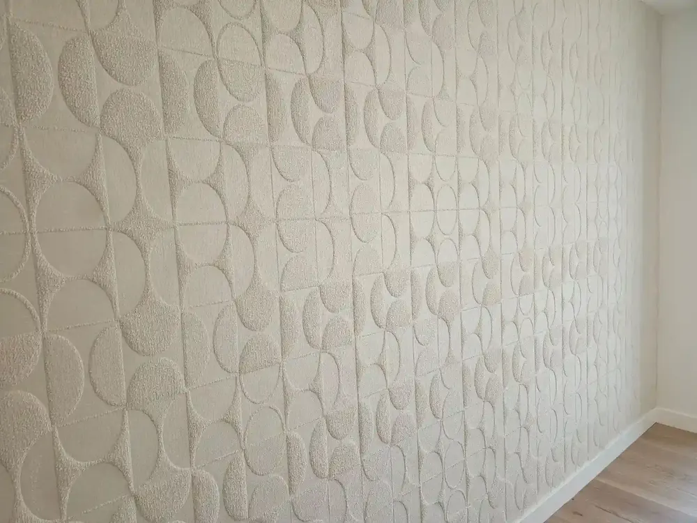 Subtle geometric wallpaper texture in a light neutral finish